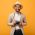 guy-in-beige-suit-and-hat-posing-with-retro-camera-C9CTR6W.jpg